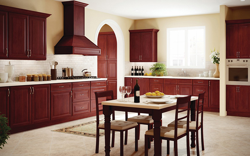 Cherry-K Dark cherry cabinets in a warm kitchen